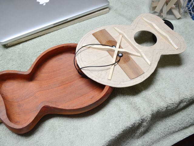 Soundboard has been braced and the bridge plate is in place. The interior of the body has three coats of finish and has been final sanded. Also the K&K Sound Twin Spot internal pickup has been installed.
